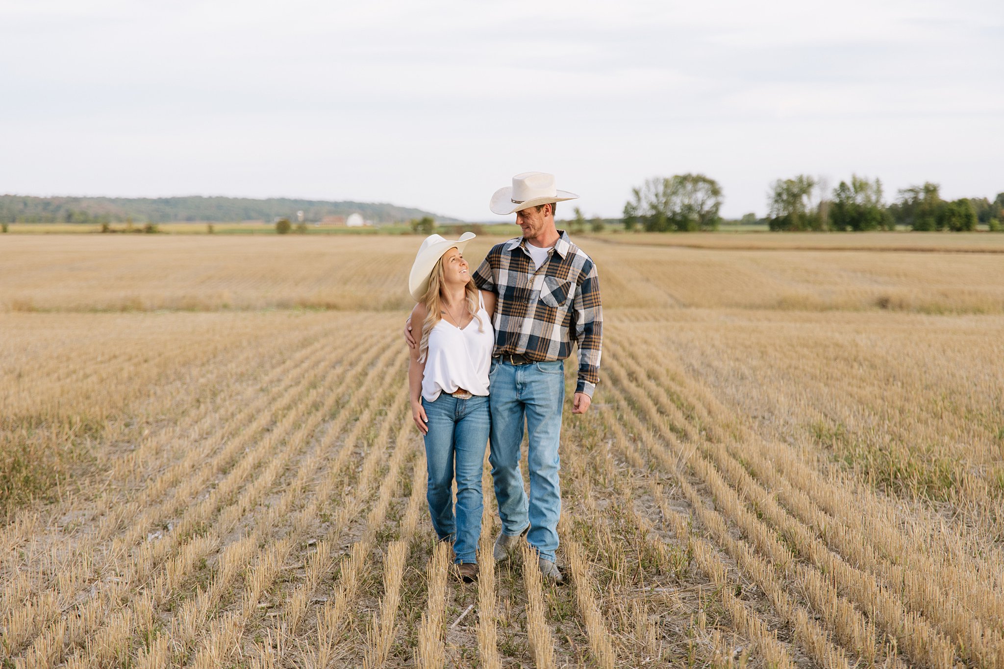 Autumn engagement session in a field outside Cobden Ontario in the Renfrew County.