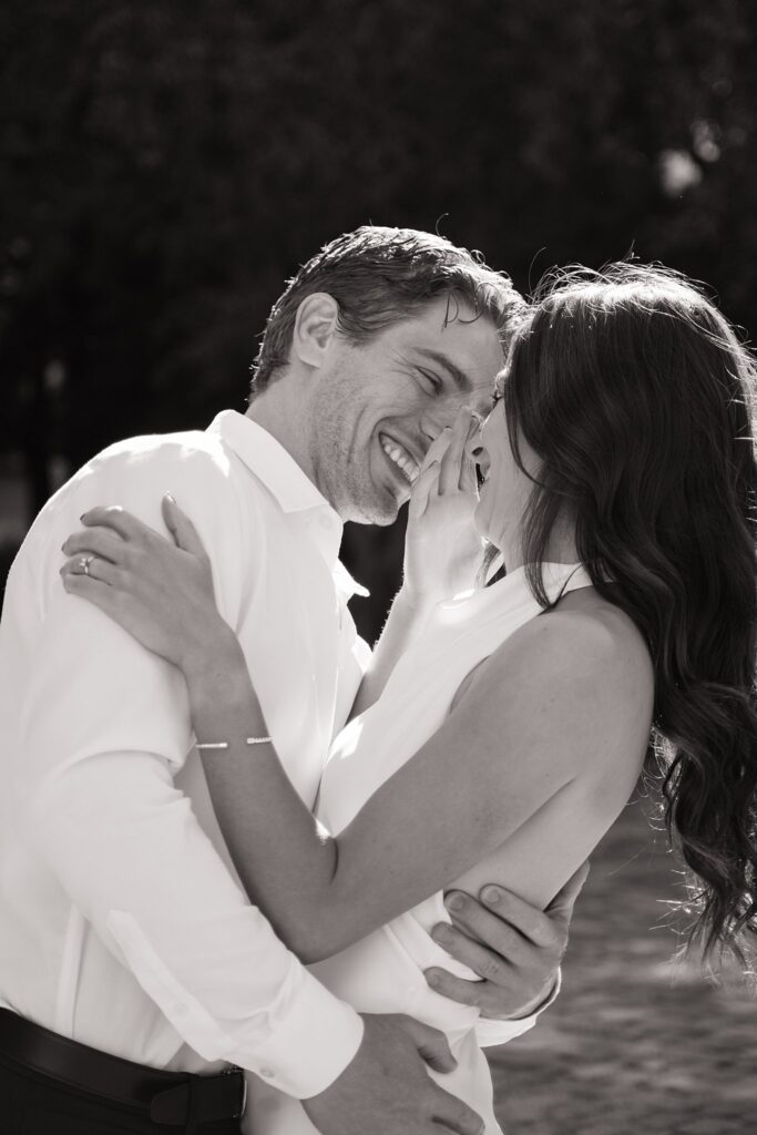 Couple taking engagement photos outside Osgoode Hall Downtown Toronto