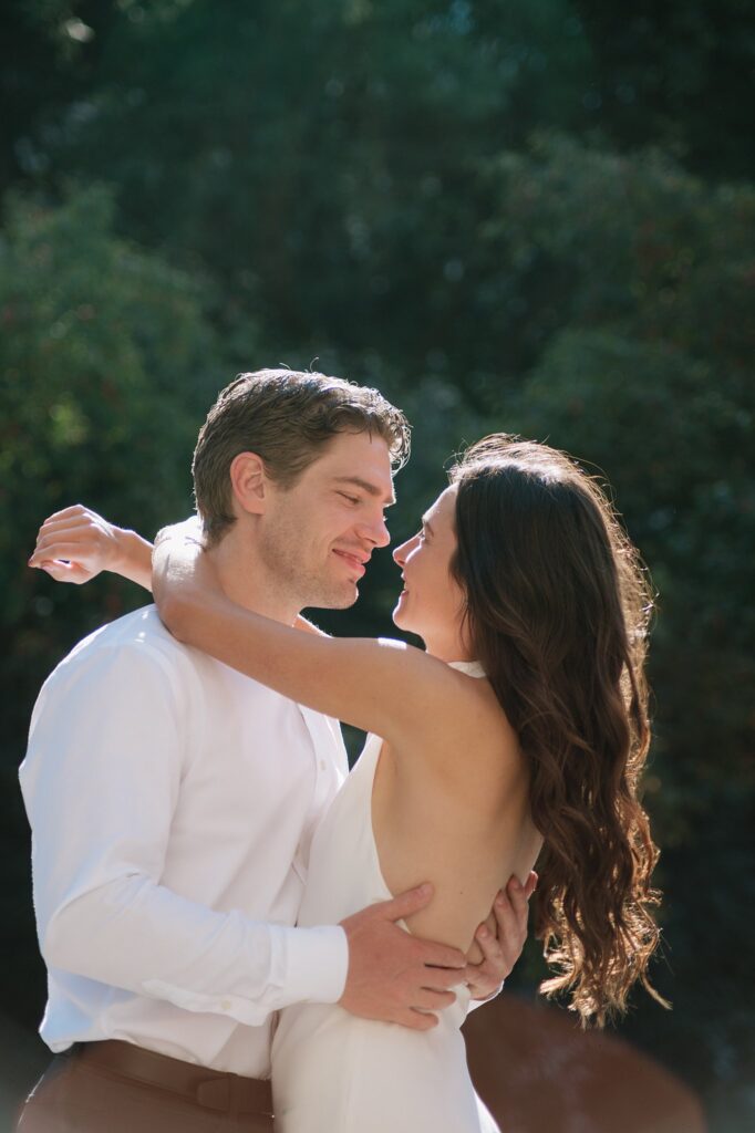 Couple taking engagement photos outside Osgoode Hall Downtown Toronto