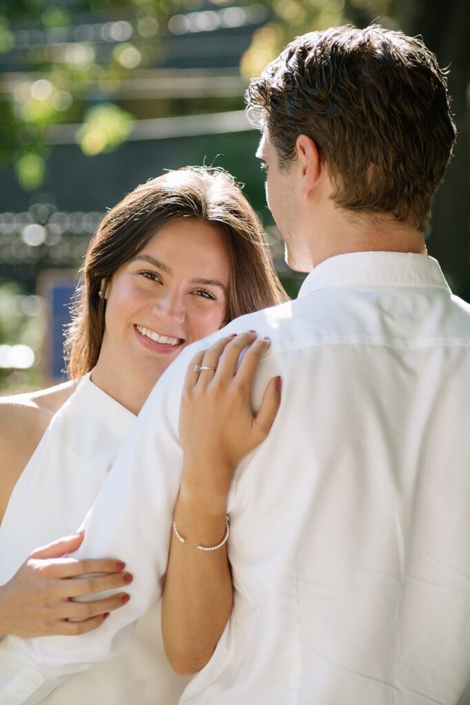 Couple taking engagement photos outside Osgoode Hall Downtown Toronto